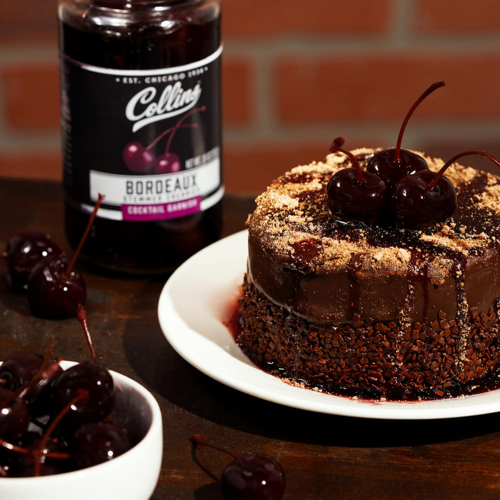 Collins Chicago stemmed Bordeaux cherries on dessert plate, gourmet topping option.