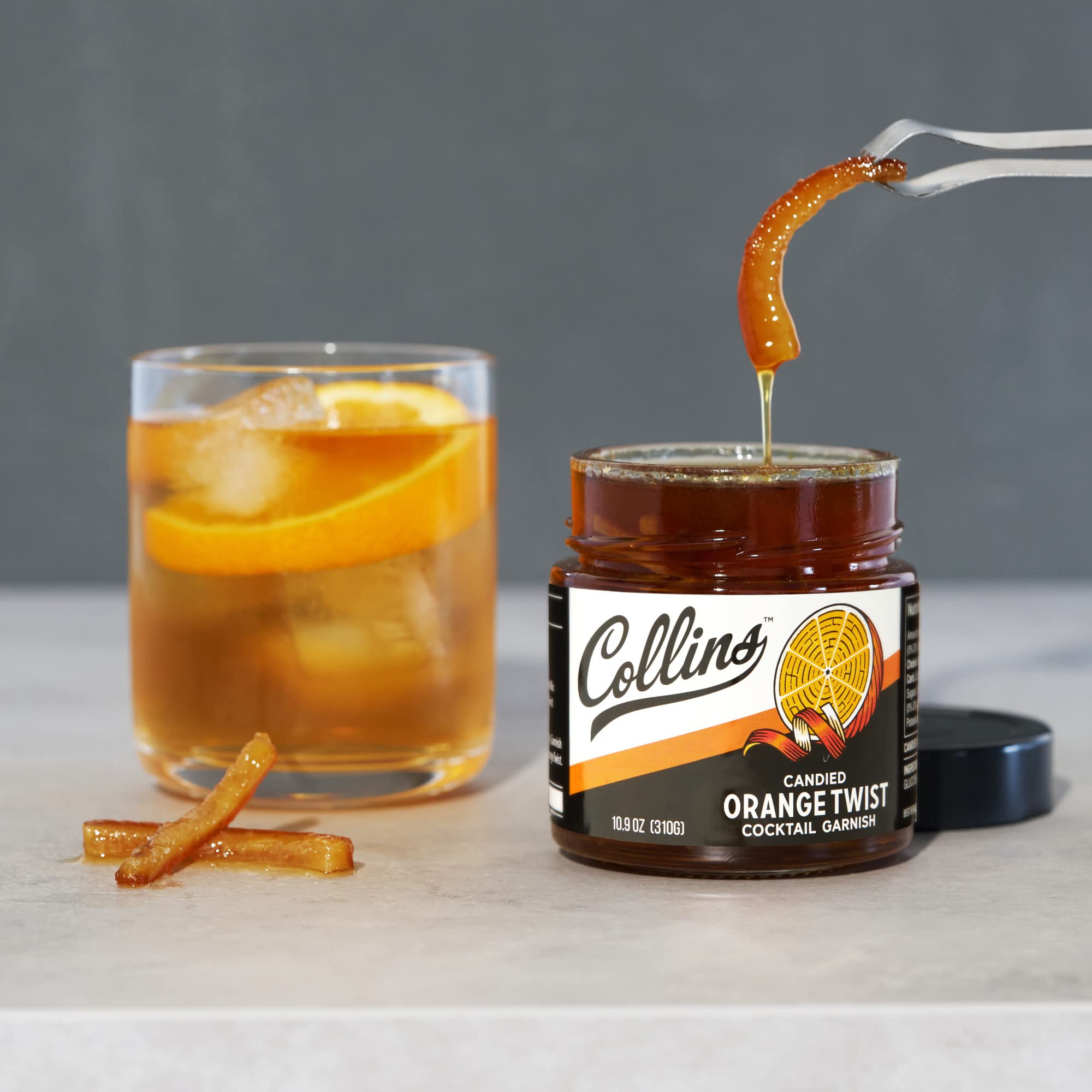 Collins Candied Orange Peel Twist on a charcuterie board enhances flavor and color
