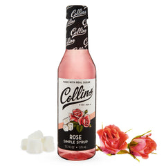 Close-up of Collins Rose Syrup with rose petals and aroma.