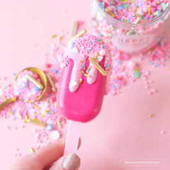 Colour Mill color in chocolate ganache yields a glossy pink finish.