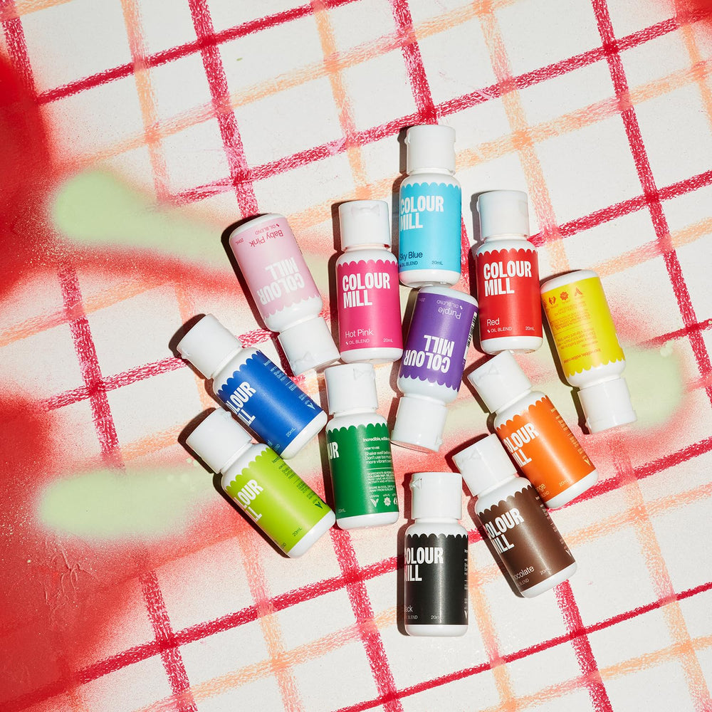 Colour Mill oil-based color pours into chocolate ganache for deep hue.