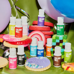 Colour Mill color blends into Swiss meringue frosting for smooth results.