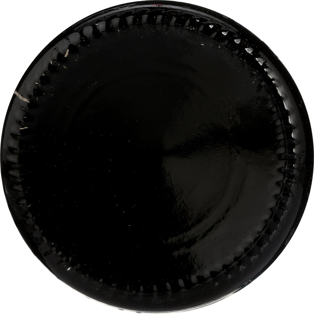 Aging barrel evokes natural maturation and layered flavor.