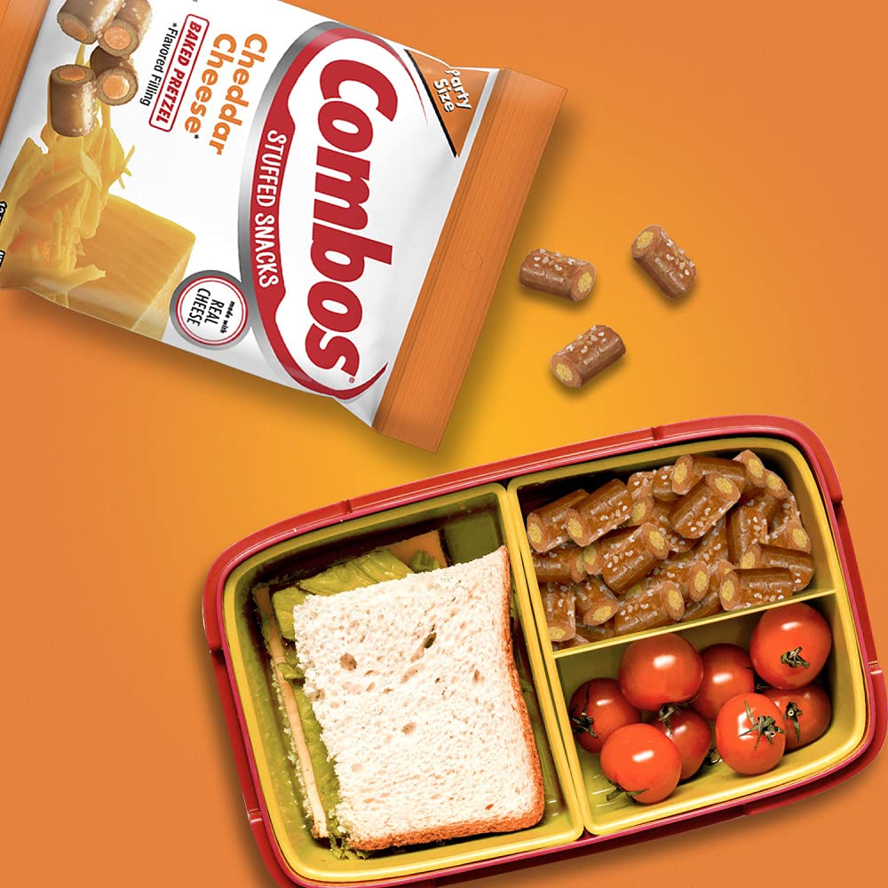 Combos Cheddar baked pretzel snacks being shared at a tailgate.