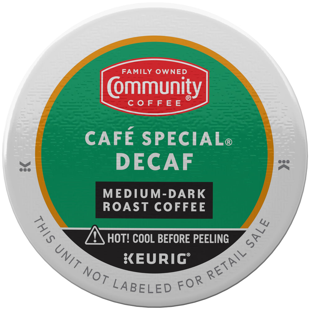 Community Coffee Café Special Decaf K-Cup Pod in a mug releasing rich aroma.