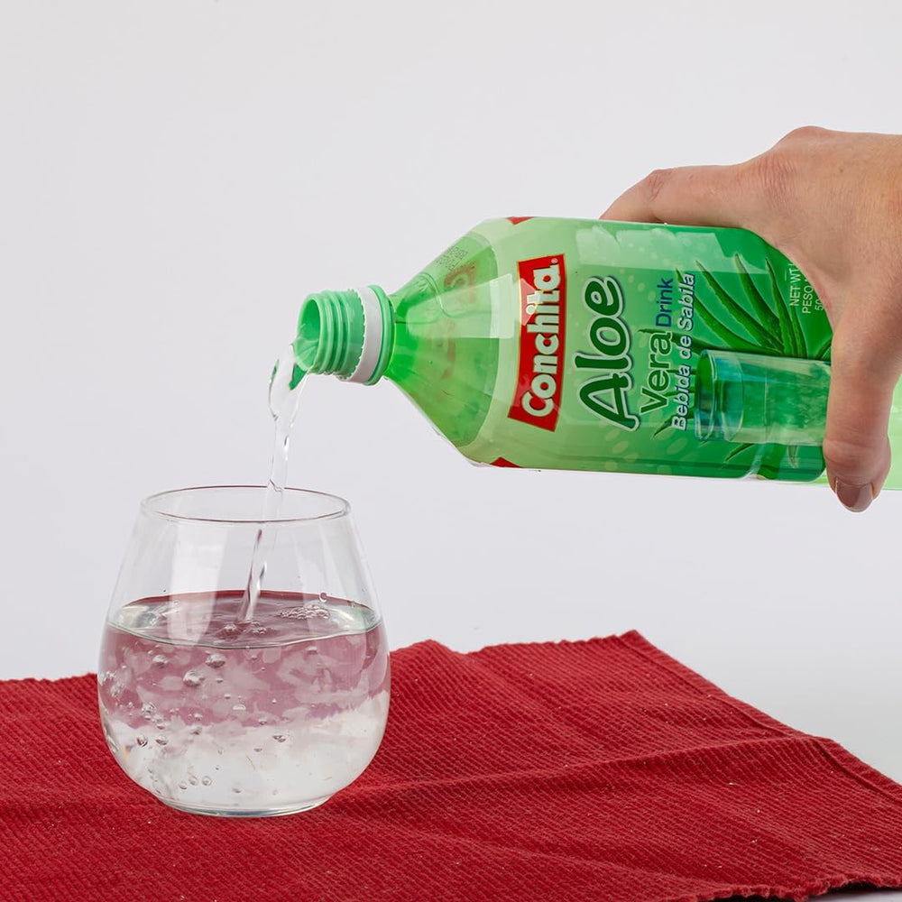 Close-up of aloe vera pulp in Conchita juice, adding unique texture and body.