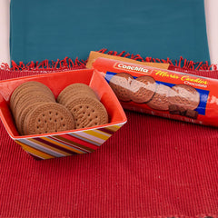 Conchita Chocolate Maria Cookies beside a mug of coffee, great for a quick breakfast on the go.