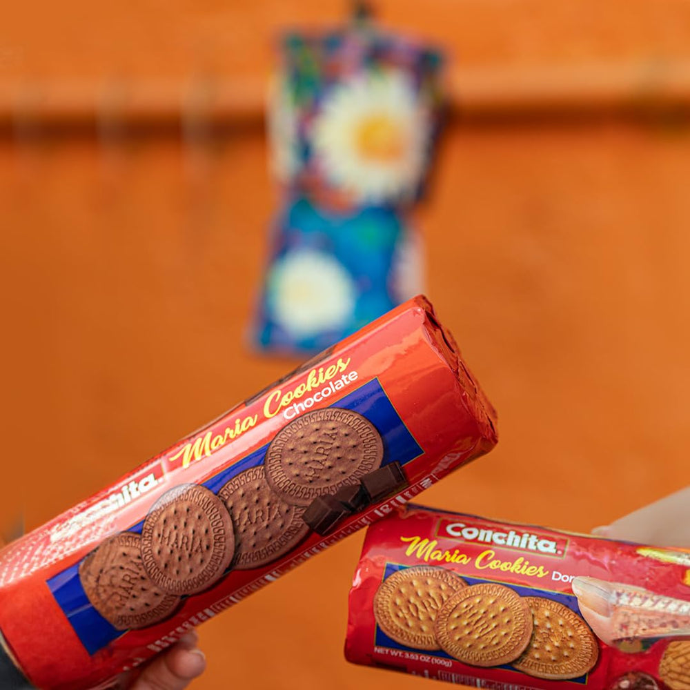 Conchita Chocolate Maria Cookies displayed with family photos signaling trusted heritage.