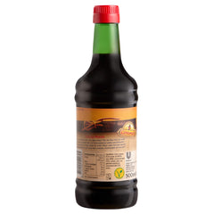 Conimex Ketjap Manis glossy glaze on a dish, ideal for marinades.