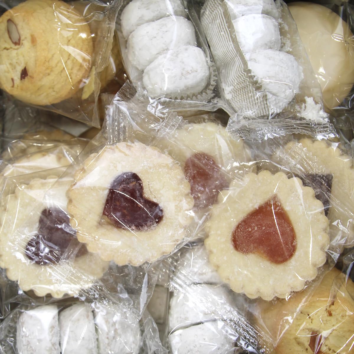 Cookies Con Amore cookie closeup reveals buttery textures and crisp edges.