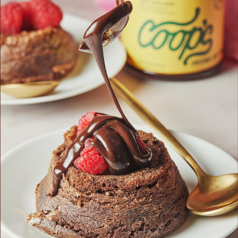 Coop's hot fudge glass jar displayed as premium topping