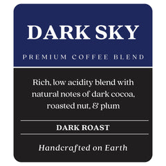 Copper Moon Dark Sky ground coffee being poured into a cup for a smooth brew.
