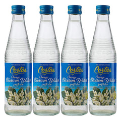 Cortas orange blossom water bottle pouring into a drink for floral citrus aroma