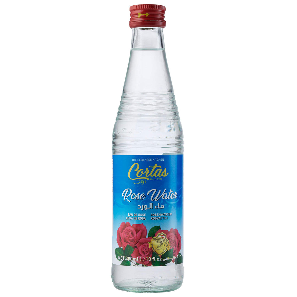 Cortas orange blossom water bottle closeup showcasing aromatic versatility for drinks and desserts.