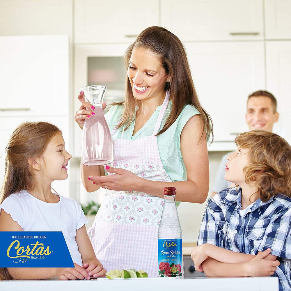CORTAS Rose Water being poured into a glass for beverages