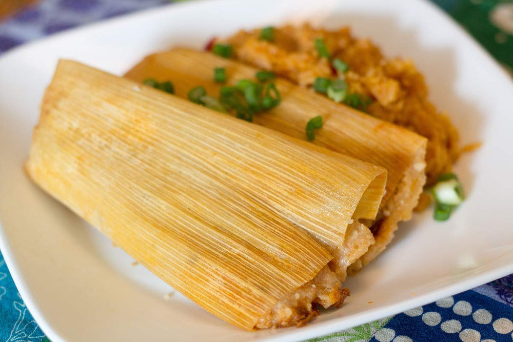 Country Creek Acres corn husk wraps steaming tamales in a pot