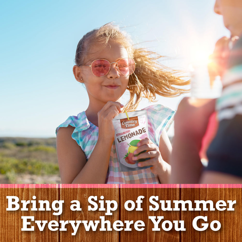 Country Time Strawberry Lemonade pouch beside backyard BBQ setup
