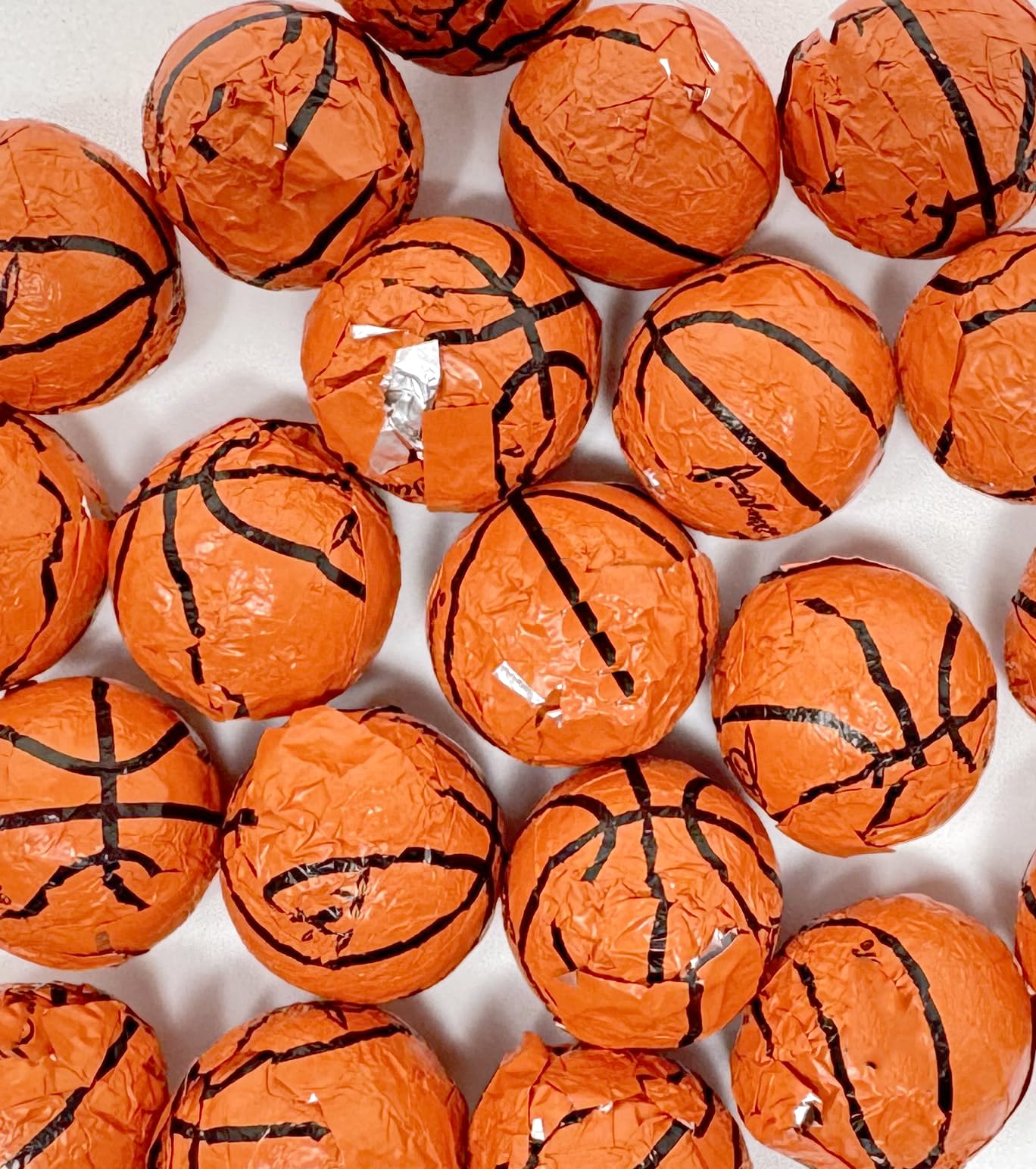 Crait basketball chocolates in hand showing bite-size pieces for concessions