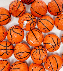 Crait basketball chocolates in hand showing bite-size pieces for concessions