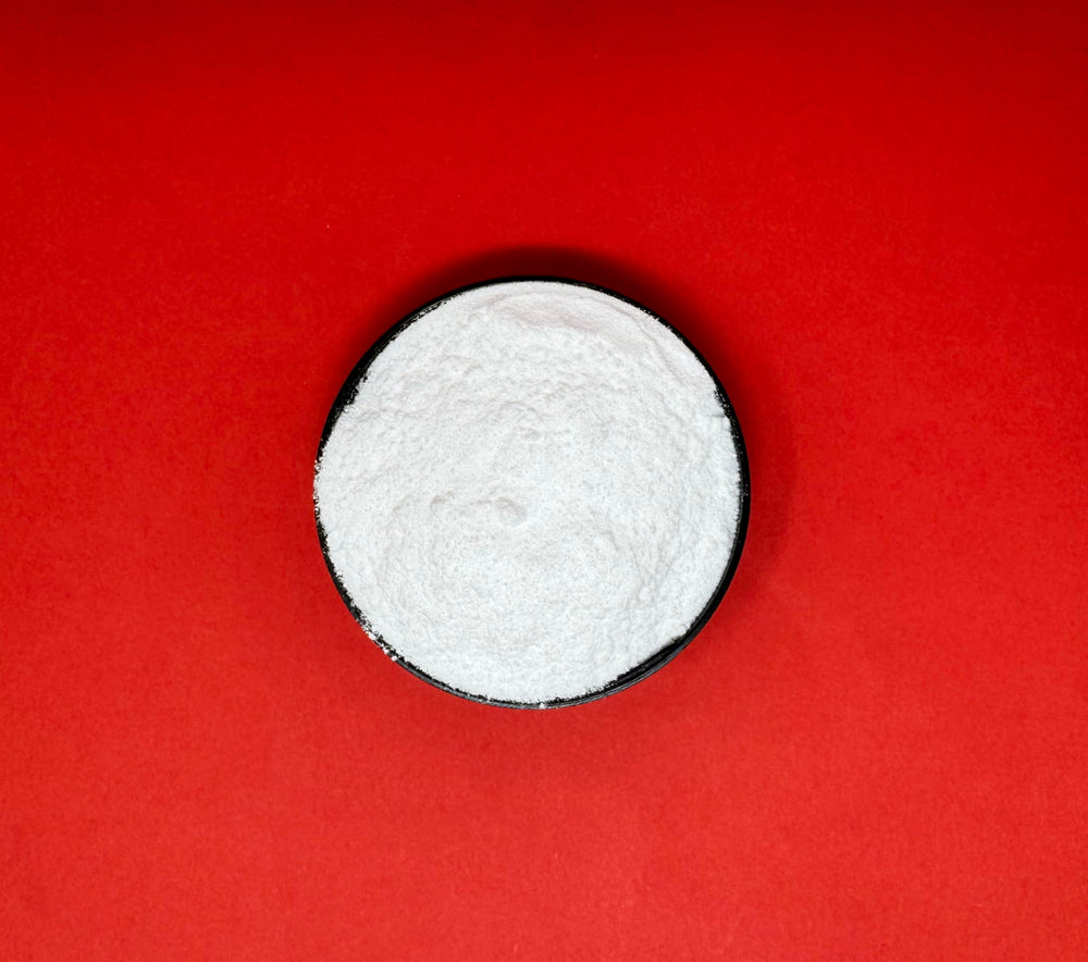 Crait lactic acid powder in a kitchen scene for ferments and tangy treats.