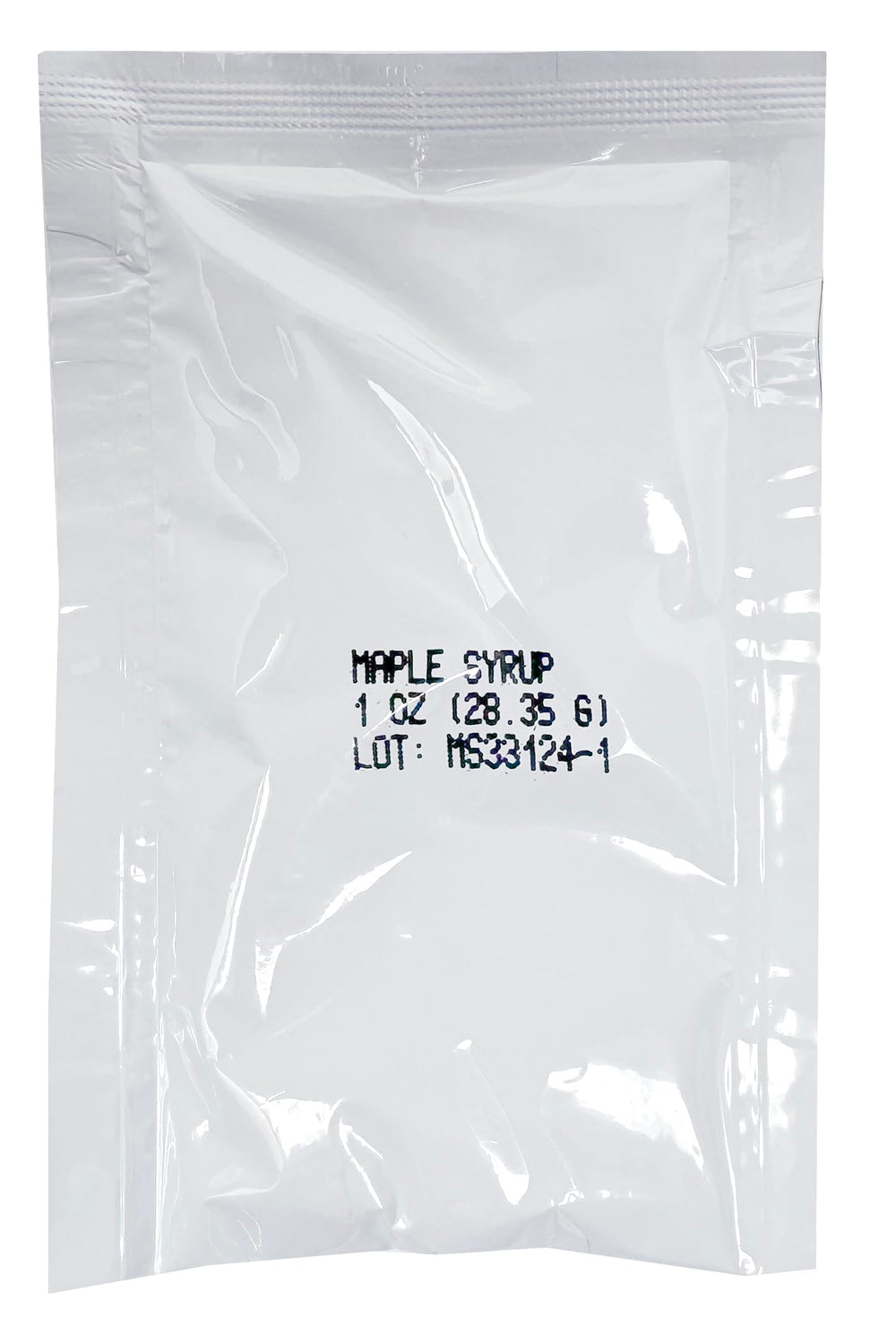 Crait maple syrup packets beside pancakes highlighting natural sweetness.