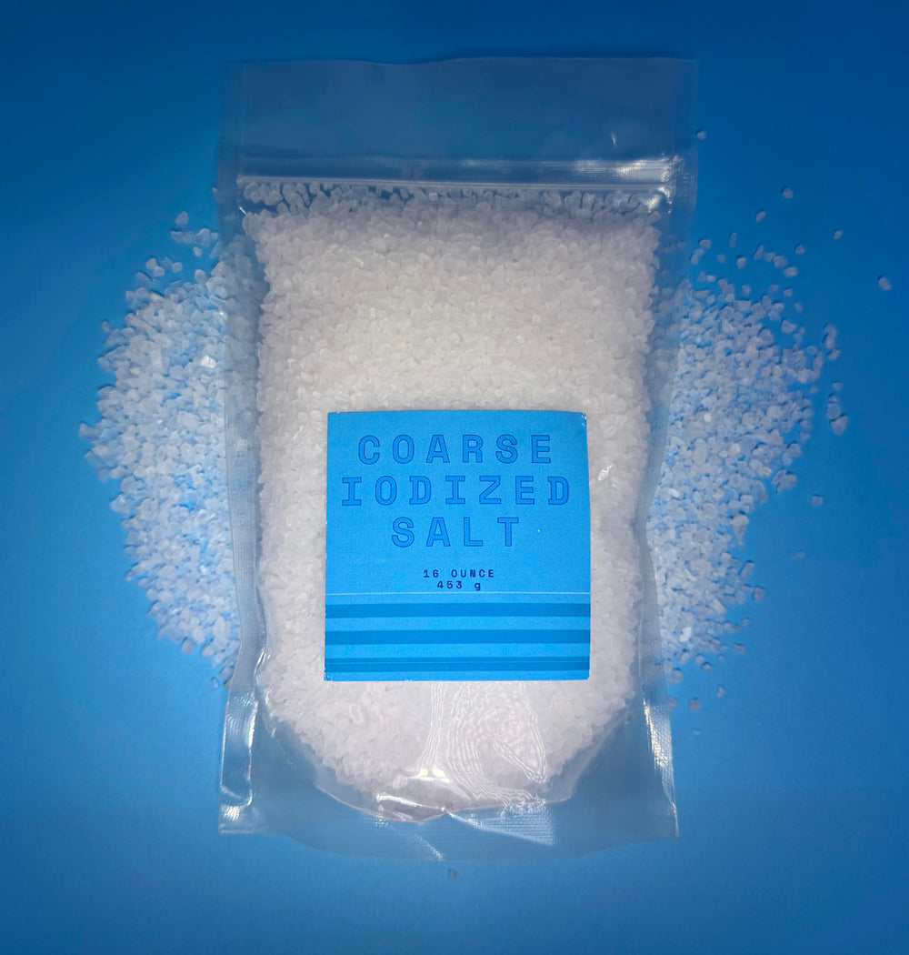 Crait salt grinder in use during meal prep for even seasoning.