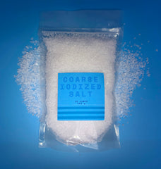 Crait salt grinder in use during meal prep for even seasoning.