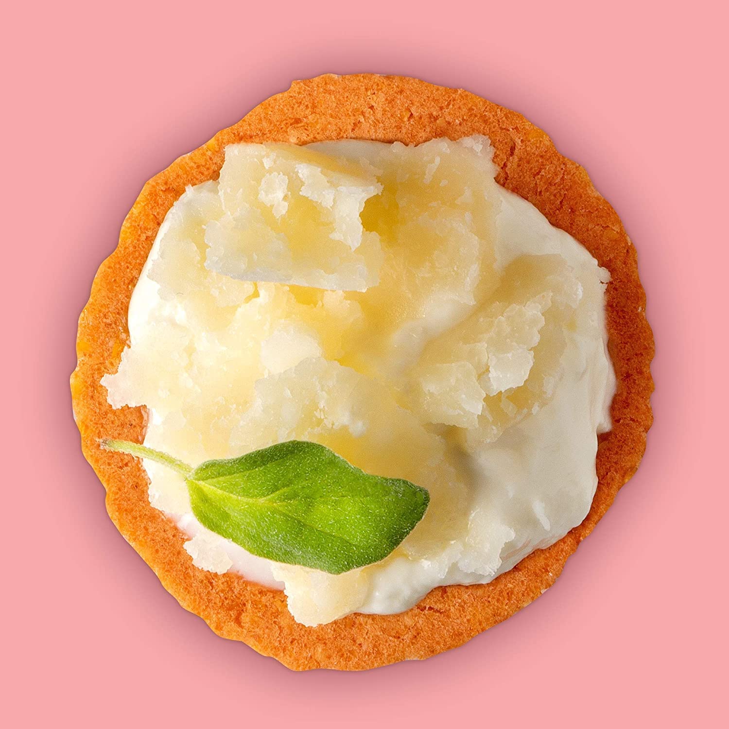 Craize Guava Crisps served with cheese on a charcuterie board.