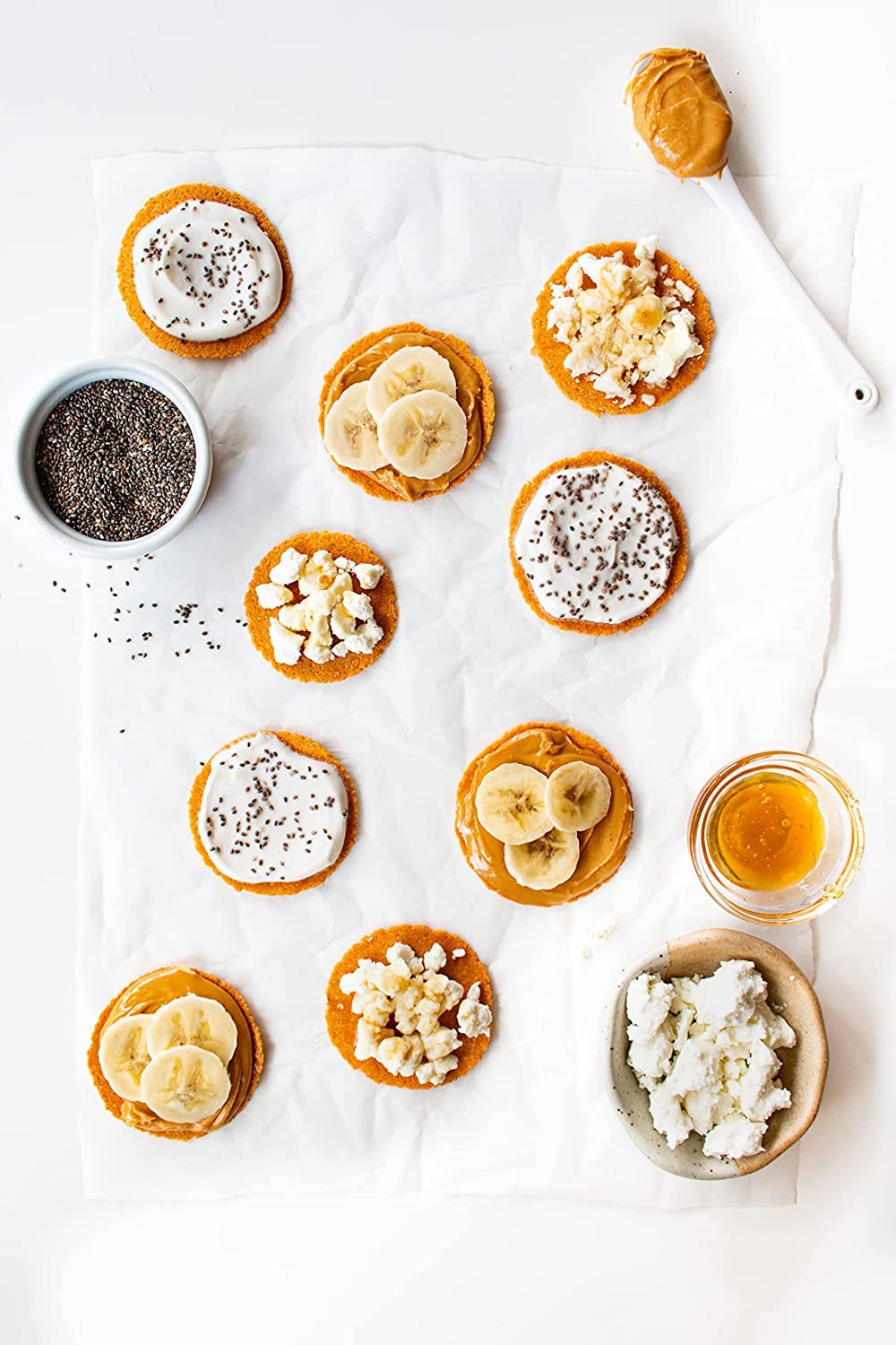 Craize Guava Crisps on a cheese board with fruit and spreads.