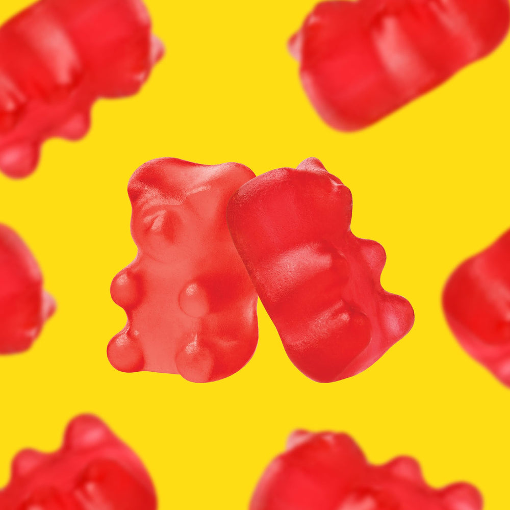 CrazyOutlet Cinnamon Bears red gummies illuminate spicy bite in party bowls.