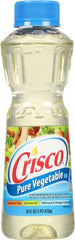 Crisco Pure Vegetable Oil bottle closeup highlights clean, neutral flavor for any recipe.