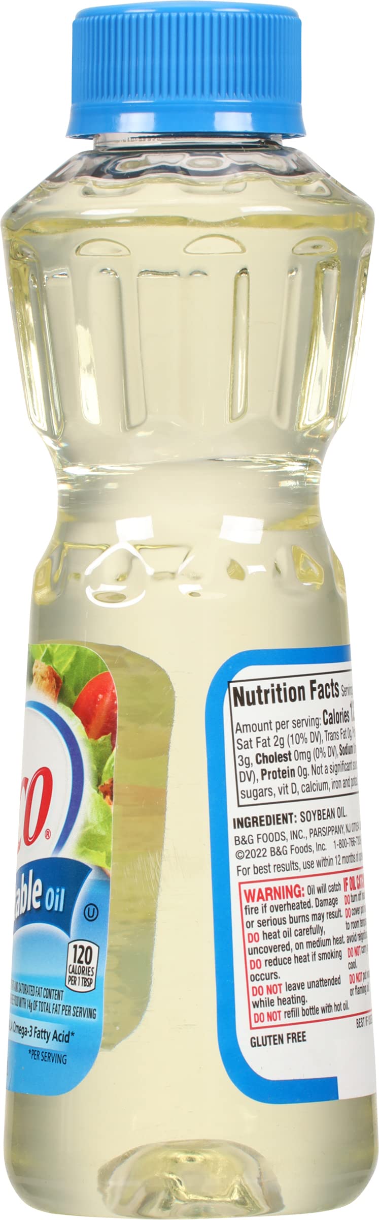 Crisco Pure Vegetable Oil bottle with salad dressing indicates neutral flavor for dressings.