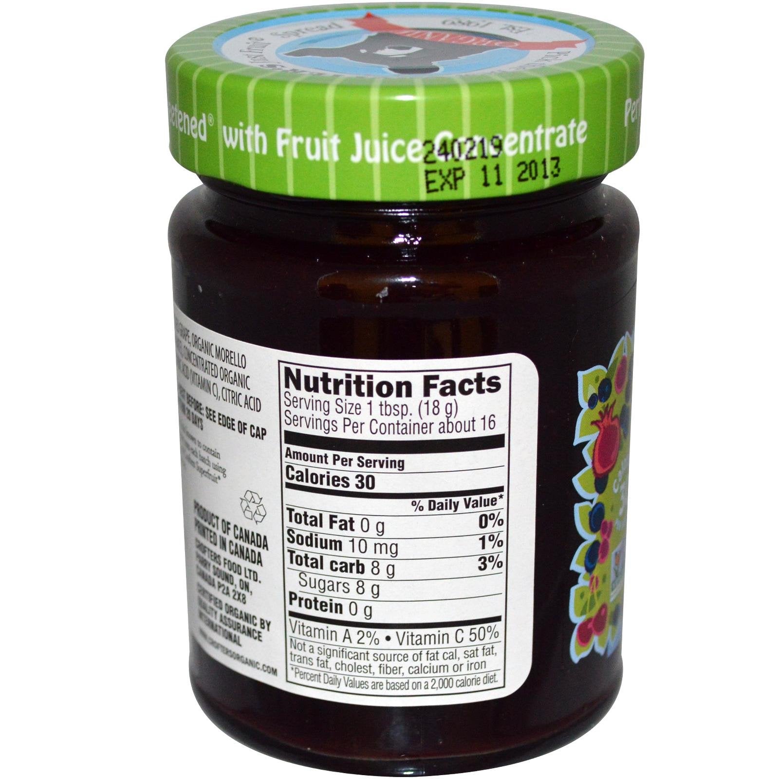 Crofters Just Fruit Spread jar open with berries; perfect for snacking.