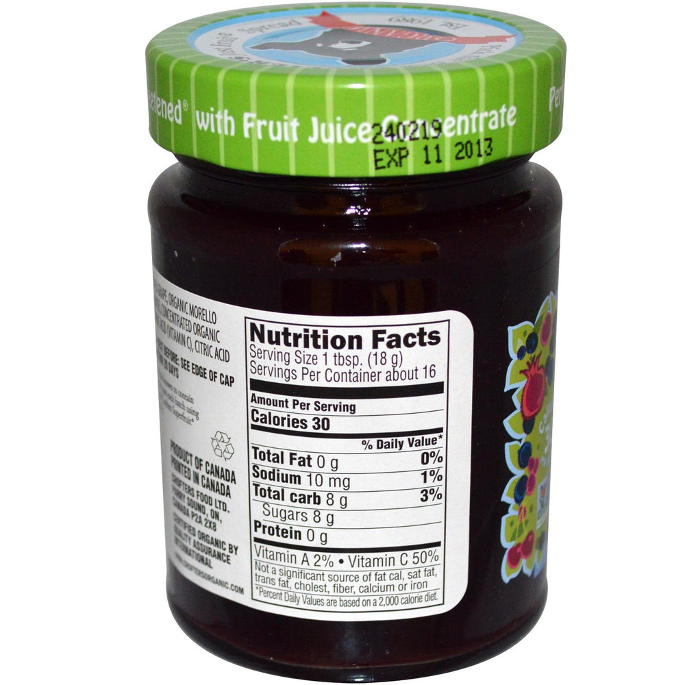 Crofters Just Fruit Spread jar open with berries; perfect for snacking.