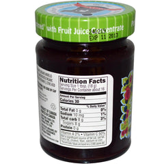 Crofters Just Fruit Spread jar open with berries; perfect for snacking.