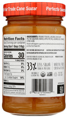 Crofters Peach Organic Premium Spread closeup on jar lid, highlighting bright fruit flavor.
