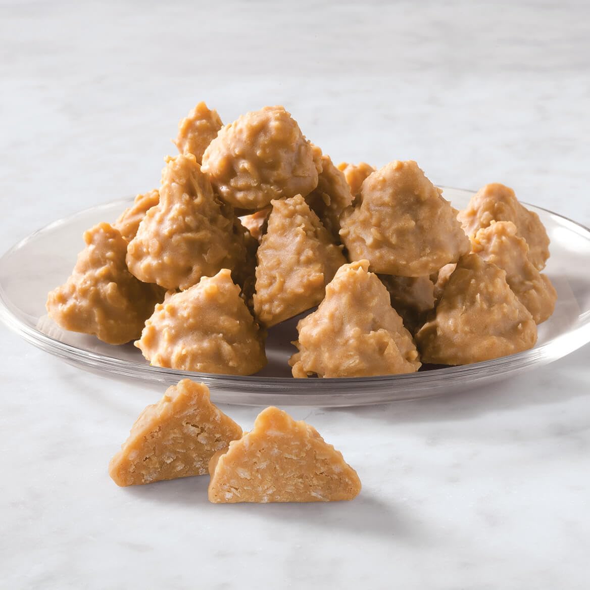Sliced portions of Crown Candy fudge reveal rich texture and coconut specks, perfect for dessert plates.