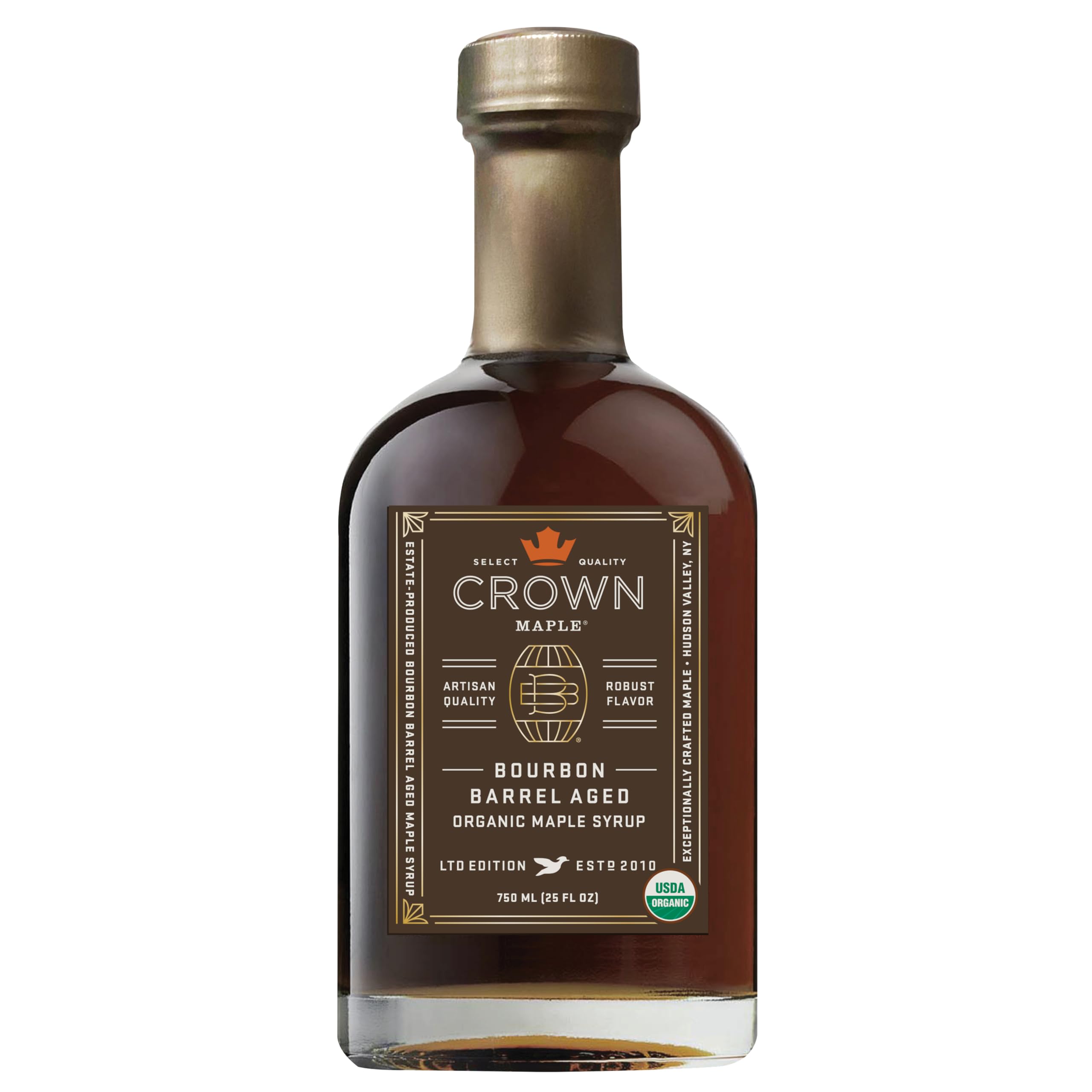 Crown Maple Bourbon Barrel Aged syrup bottle on counter, ideal for pancakes.
