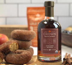 Crown Maple Cinnamon Infused Maple Syrup being poured over waffles for flavor.