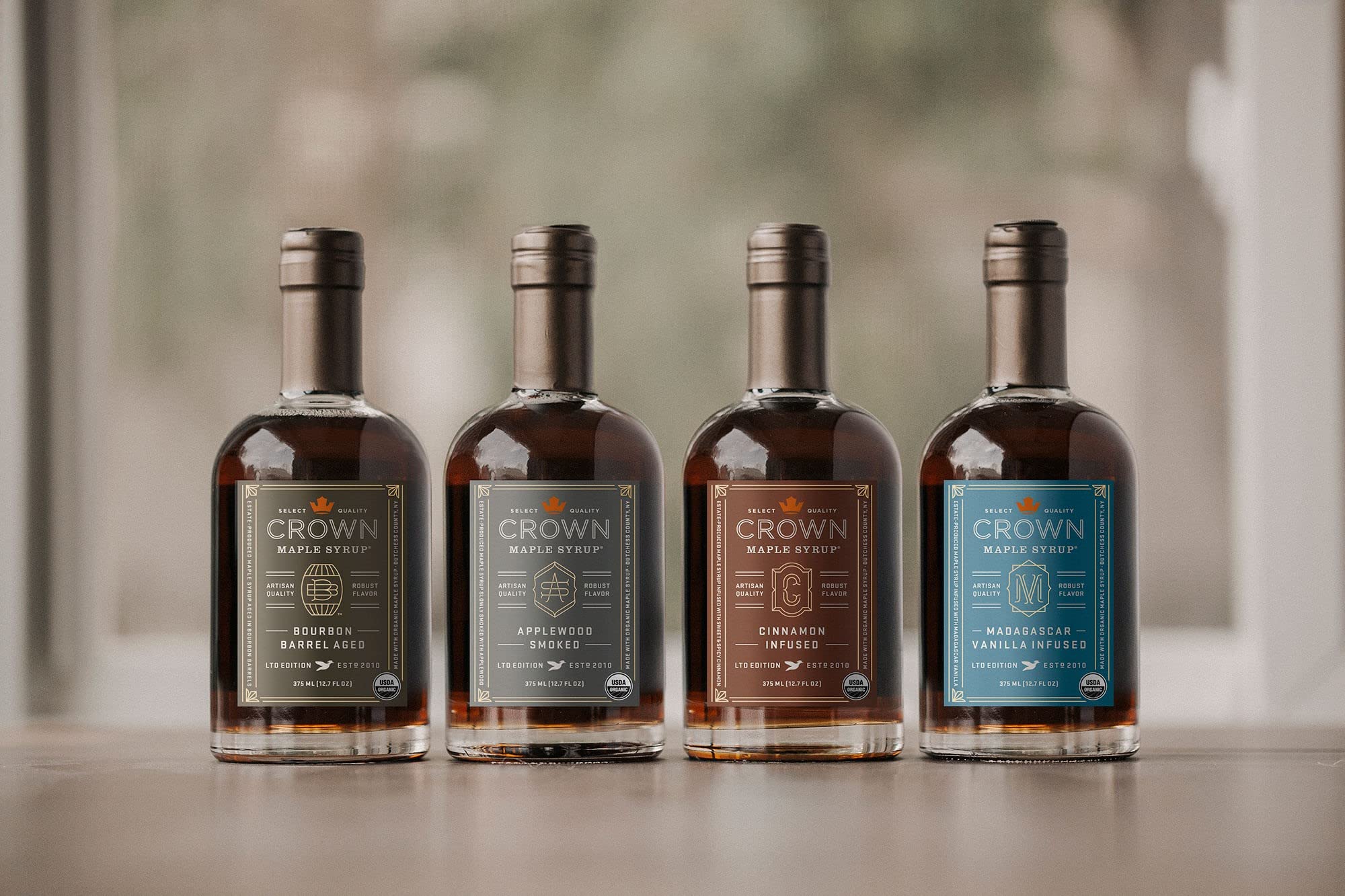 Organic Crown Maple syrup in amber bottle showing quality.