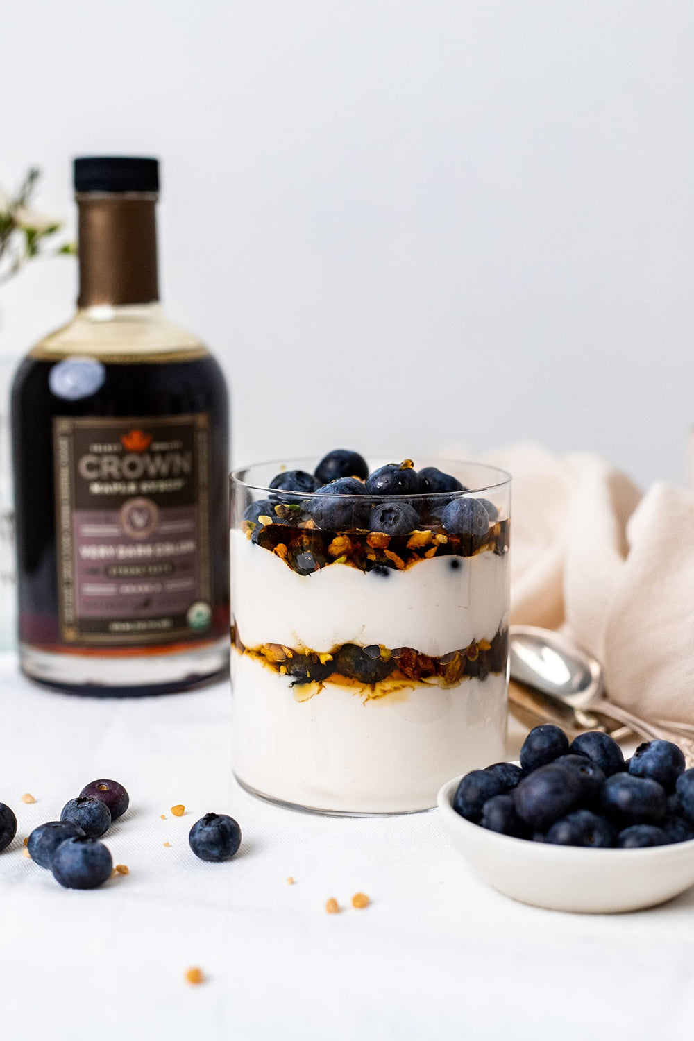 Crown Maple Very Dark Color drizzled on pancakes for bold breakfast flavor.