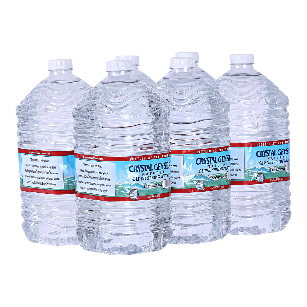 Crystal Geyser Alpine Spring Water 6-gallon jug on kitchen counter for home hydration.