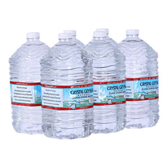Crystal Geyser Alpine Spring Water 6-gallon jug on kitchen counter for home hydration.