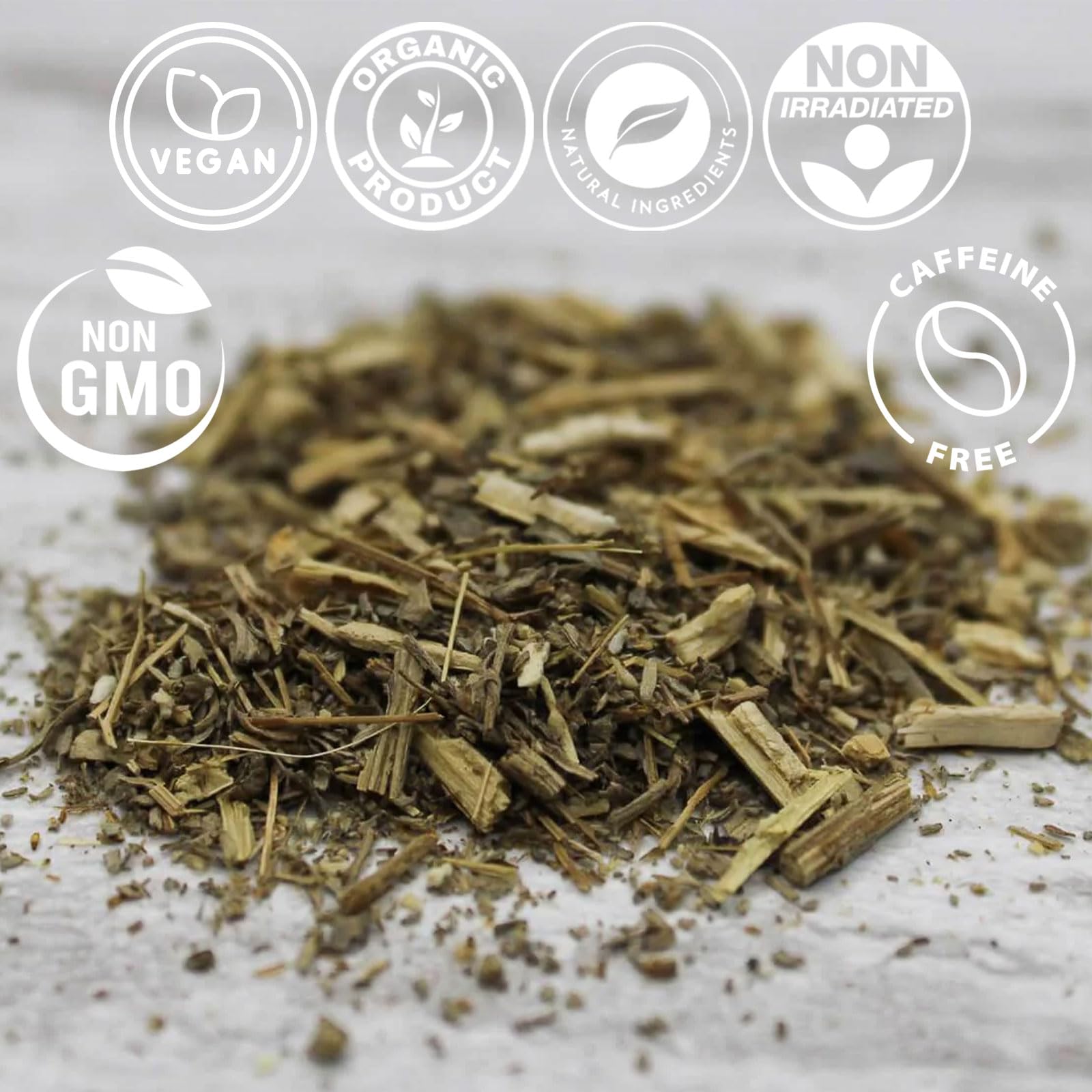 Measuring 1-2 teaspoons of Cure wid Pure wormwood with wooden spoon