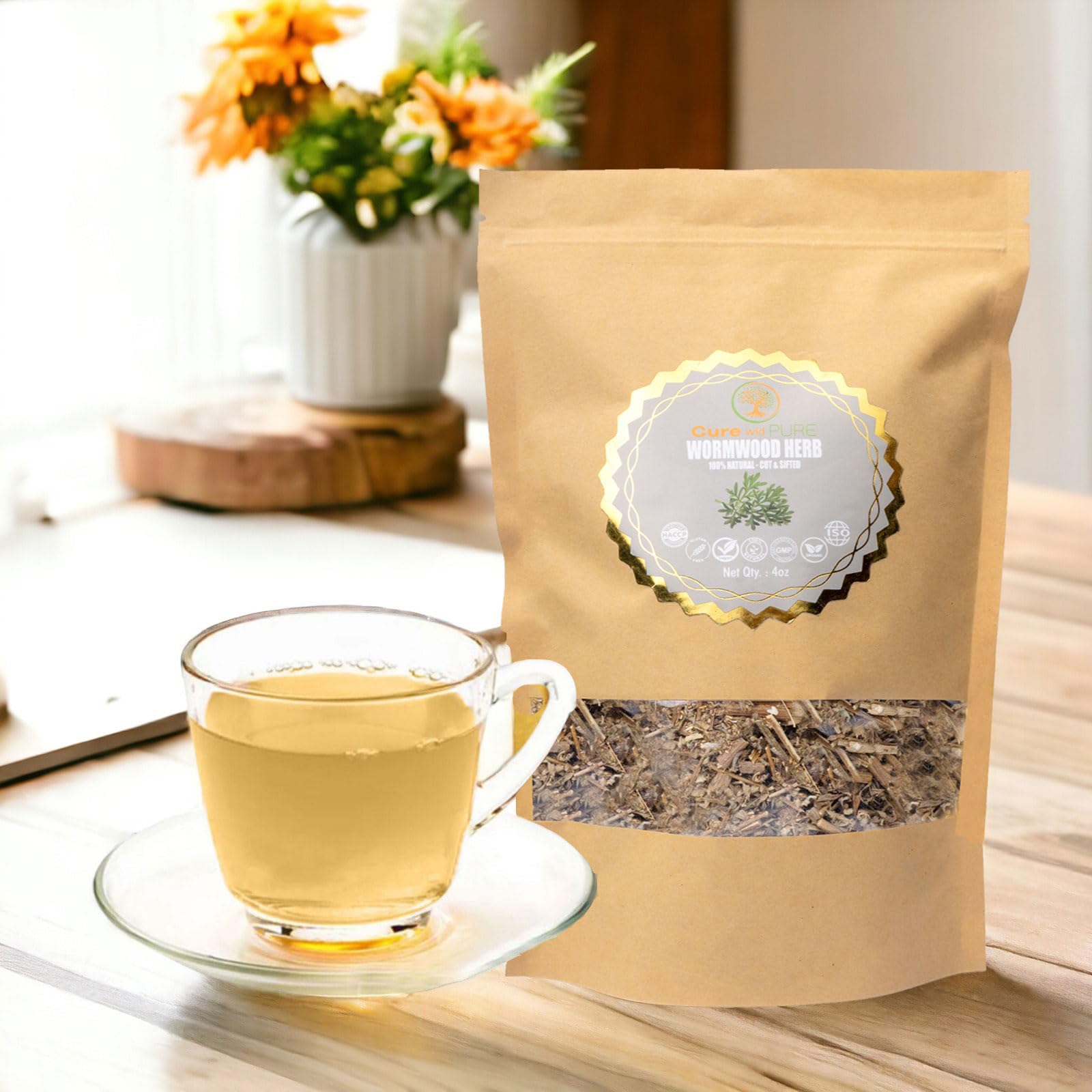 Cup of wormwood tea from Cure wid Pure steeping to reveal aroma