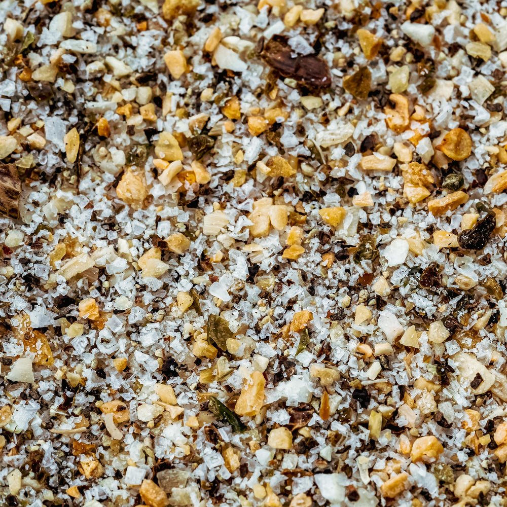 Cuso Cuts Gravel BBQ Rub vegetables on grill with seasoning