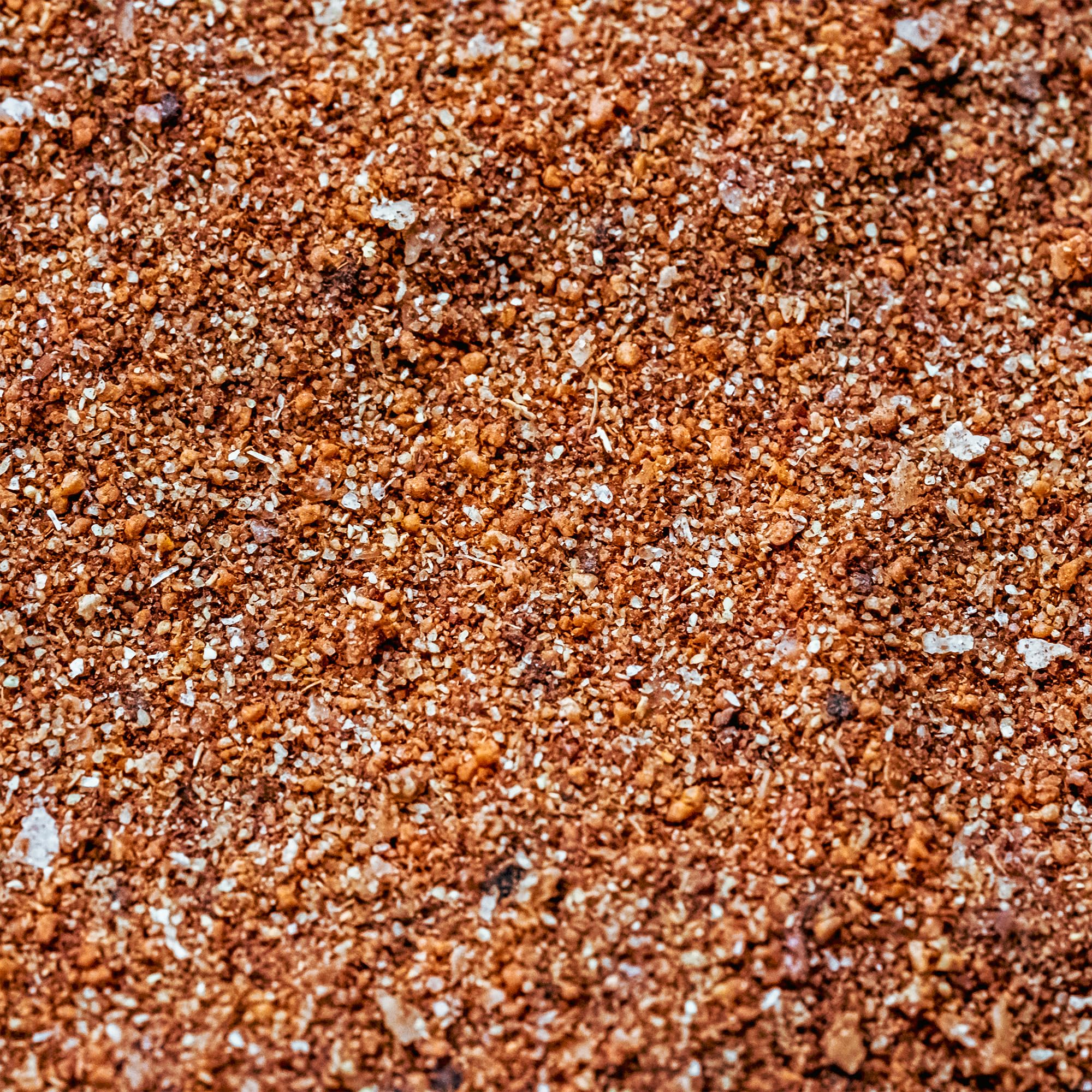 Beef ribs or brisket seasoned with Cuso's Cuts Rub for smoky flavor