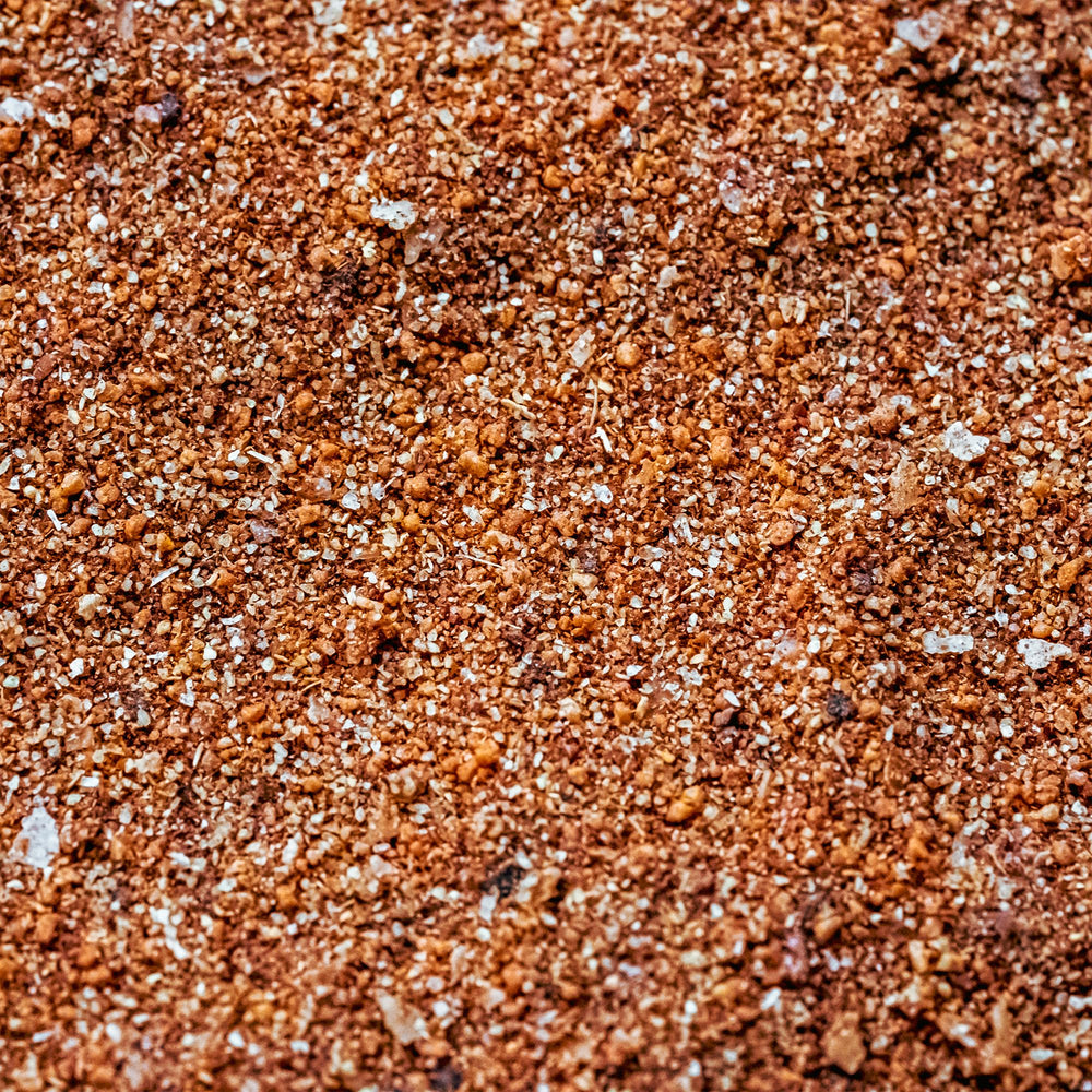 Beef ribs or brisket seasoned with Cuso's Cuts Rub for smoky flavor