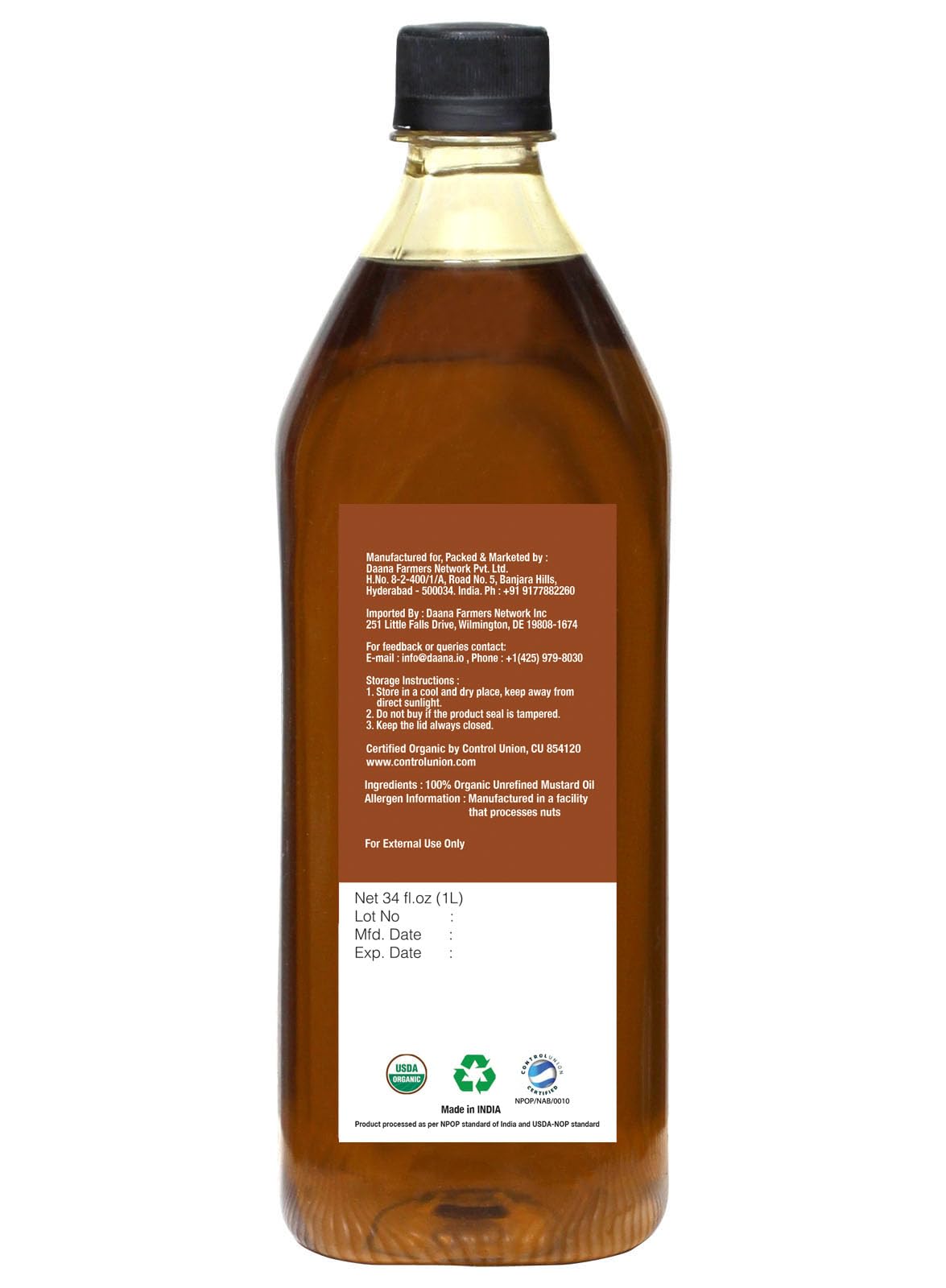 Amber DAANA mustard oil bottle on kitchen counter