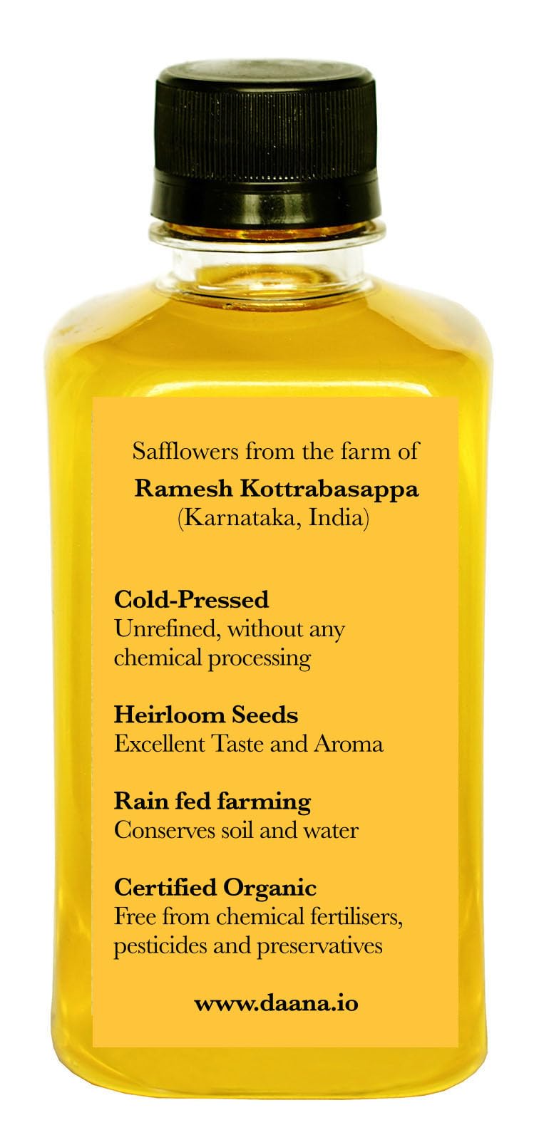Daana Safflower Oil drizzle over a fresh salad highlighting color.